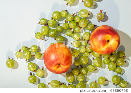 Peach or nectarine and peach slice with leaf on 68860768