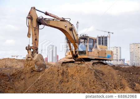 Excavator during earthworks at construction site 68862068