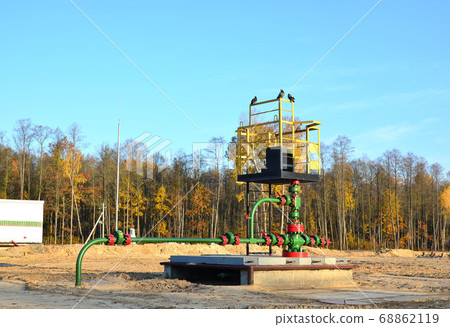 Industrial piping with steel flanges and bolts on oil field 68862119