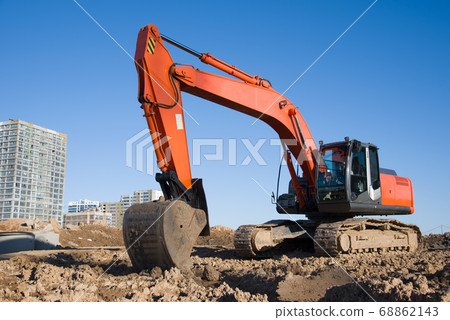 Excavator during earthmoving at construction site. 68862143