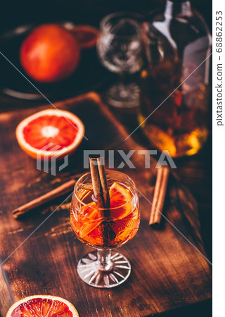 Glass of orange whiskey sour cocktail 68862253