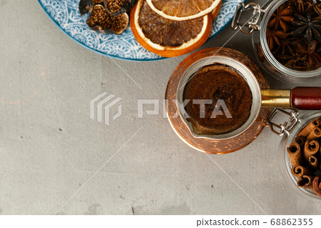 Copper turk with coffee and dried fruit pieces on table Copper turk with coffee and dried fruit pieces on table 68862355