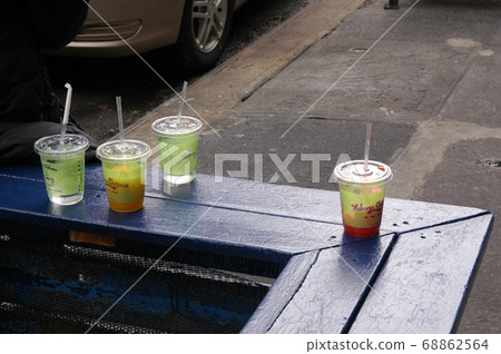 The storefront of a cafe in New York. Someone's ice tea. The storefront of a cafe in New York. Someone's ice tea. 68862564