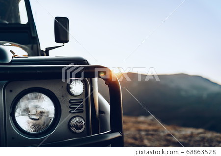 Dark green off-road car in the mountains Dark green off-road car in the mountains 68863528