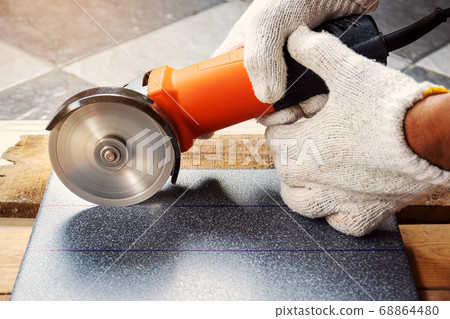 Cut the tiles with an electric grinder. Cut the tiles with an electric grinder. 68864480