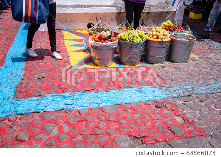 A person selling sweetened fruits and sweet potatoes on the road in Puebla, Mexico 68866073