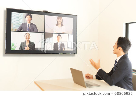 Man having an online meeting Man having an online meeting 68866925