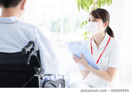 Medical nurse (female) listening to patients 68869950
