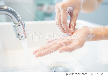Hygiene,Hands of child girl rubbing her hands,washing frequently with an antiseptic soap,protection against viruses and bacteria infection,cleaning hand to stop spread of Covid-19,Coronavirus pandemic 68871340