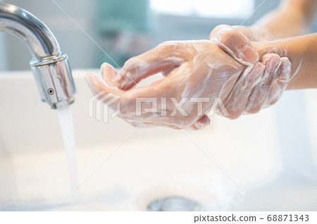 Hygiene,Hands of child girl rubbing her hands,washing frequently with soap,avoid contamination of viruses,outbreak of Covid-19,disinfection,cleaning hand to stop spread bacteria,Coronavirus pandemic 68871343