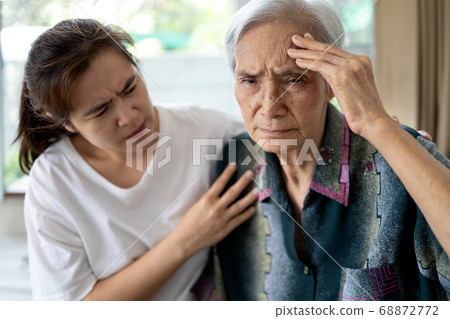 Exhausted tired asian senior woman touching head with her hands, ill elderly has vertigo,dizziness,sick old people suffering from severe headache,chronic migraine,brain tumor,hypertension,brain canc Exhausted tired asian senior woman touching head with her hands, ill elderly has vertigo,dizziness,sick old people suffering from severe headache,chronic migraine,brain tumor,hypertension,brain canc 68872772