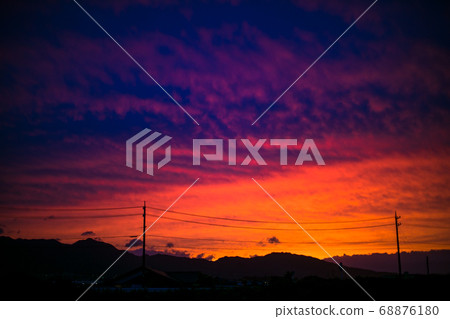 Sunset sky mountain range silhouette 68876180