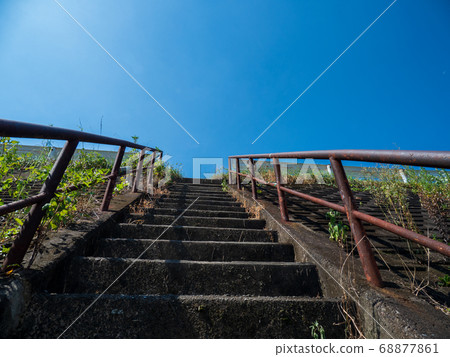 Summer blue sky and rusted railing stairs August 68877861