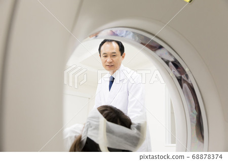 Operator undergoing CT examination 68878374