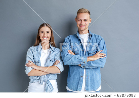 Young couple together free style isolated on grey 68879098