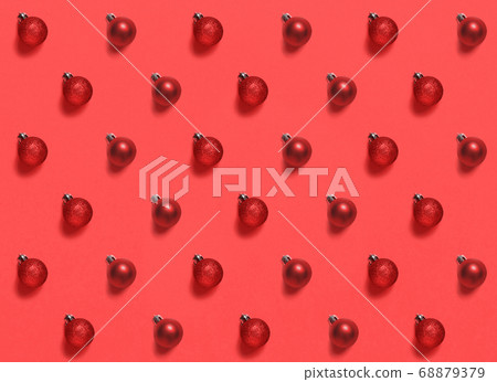 Red Christmas baubles on a red background pattern Red Christmas baubles on a red background pattern 68879379