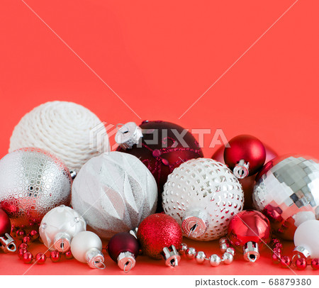 Christmas baubles on a red background Christmas baubles on a red background 68879380