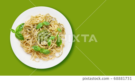 Fettuccine pasta with pesto sauce and basil Fettuccine pasta with pesto sauce and basil 68881731