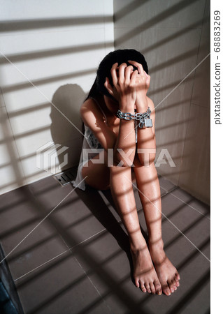 sexual assault and imprisoned woman in jail with chain waiting for help sexual assault and imprisoned woman in jail with chain waiting for help 68883269