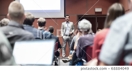 Business speaker giving a talk at business conference meeting event. 68884049