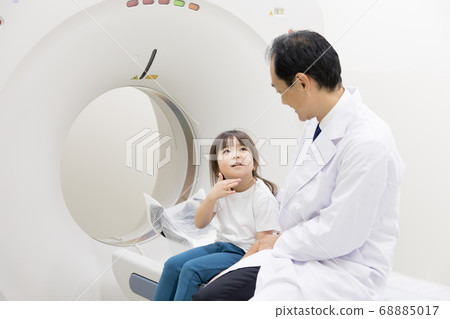 Girl undergoing CT examination 68885017