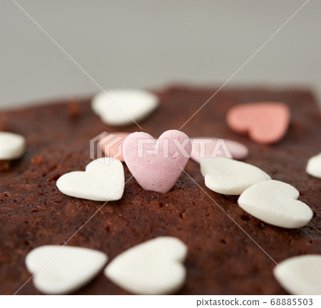 heart-shaped sugar topping on brownie chocolate 68885503