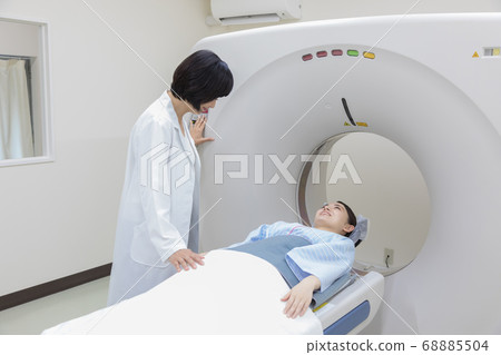 Young woman undergoing CT examination 68885504