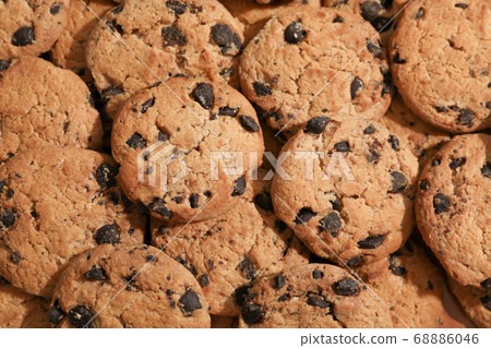 Tasty chocolate chip cookies as background, top 68886046