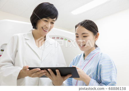 Young woman undergoing CT examination 68886138