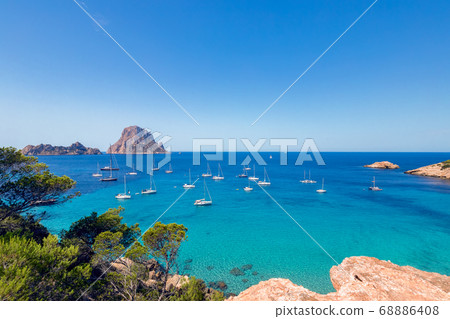 Beautiful panoramic view of Cala Hort and the mountain Es Vedra. Ibiza, Balearic Islands, Spain Beautiful panoramic view of Cala Hort and the mountain Es Vedra. Ibiza, Balearic Islands, Spain 68886408