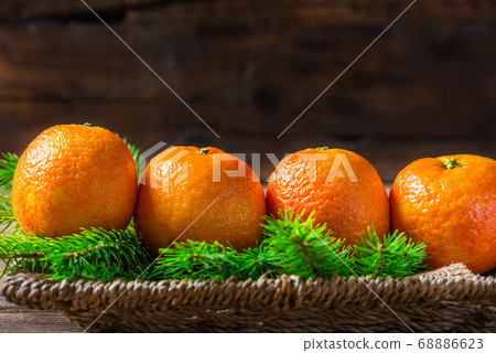 Fresh Clementines or Tangerines and Xmas Tree Fresh Clementines or Tangerines and Xmas Tree 68886623