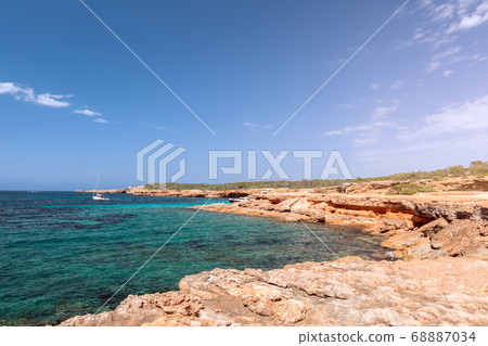 Rocky coast and the purest sea water of the Ibiza island. Balearic Islands, Spain 68887034