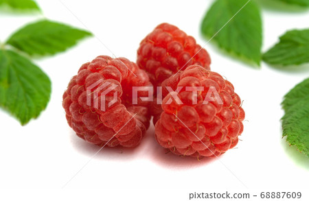 Three ripe raspberries isolate on white background Three ripe raspberries isolate on white background 68887609
