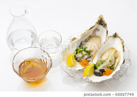 Raw oysters and sake on the shell Raw oysters and sake on the shell 68887749