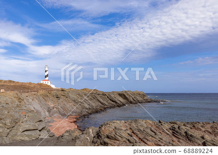 Seascape with a quiet sea bay and a lighthouse (Faro de Favaritx) on the island of Menorca Seascape with a quiet sea bay and a lighthouse (Faro de Favaritx) on the island of Menorca 68889224
