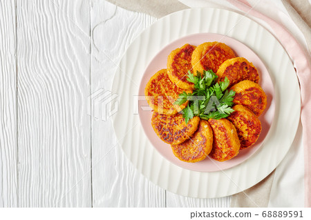 Healthy vegan butternut squash cakes on a plate 68889591
