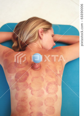 young woman lies on a carpet with traces of vacuum young woman lies on a carpet with traces of vacuum 68890006