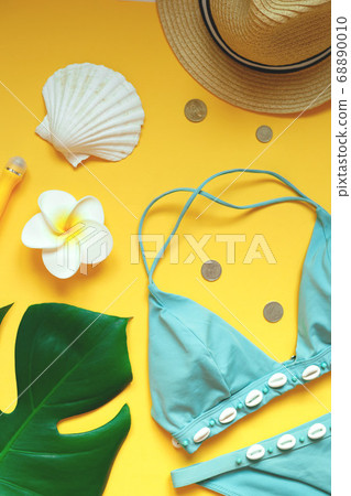 set of summer beach accessories on a yellow set of summer beach accessories on a yellow 68890010