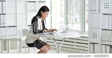 Portrait of a businesswoman working in office Portrait of a businesswoman working in office 68890041
