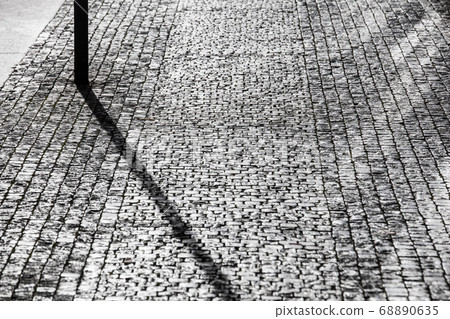 cobblestone pavement on sunny day 68890635
