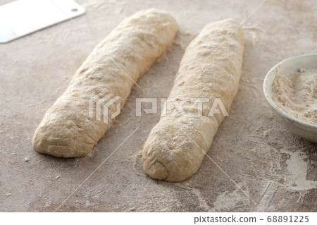 Raw baguette dough with whole grain rye flour. Copy space. Raw baguette dough with whole grain rye flour. Copy space. 68891225