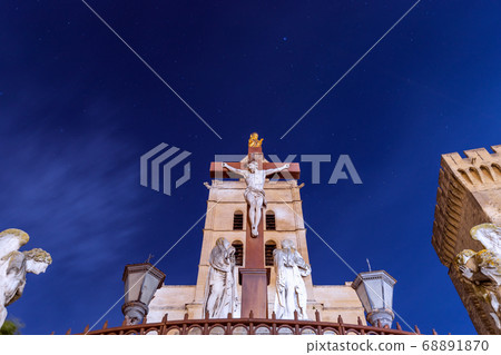Monument of Crucifixion of Jesus under a sky full of stars in the square of the Cathedral Monument of Crucifixion of Jesus under a sky full of stars in the square of the Cathedral 68891870