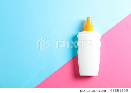 Sunscreen spray on two tone background, space for Sunscreen spray on two tone background, space for 68891899