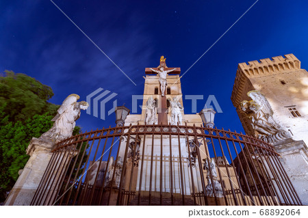 Monument of Crucifixion of Jesus under a night sky in the square of the Cathedral Monument of Crucifixion of Jesus under a night sky in the square of the Cathedral 68892064