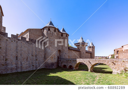 The old bridge over the moat leading to the castle of Carcassonne town The old bridge over the moat leading to the castle of Carcassonne town 68892289