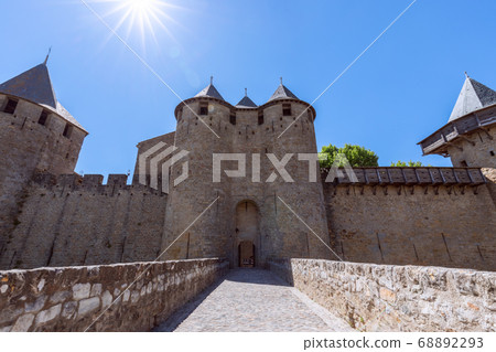 The main entrance from the bridge to the medieval castle of Carcassonne town The main entrance from the bridge to the medieval castle of Carcassonne town 68892293
