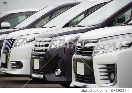 Cars lined up at dealers Toyota minivans Cars lined up at dealers Toyota minivans 68892394