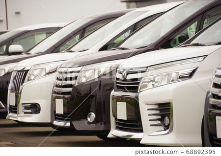 Minivans lined up at dealerships 68892395