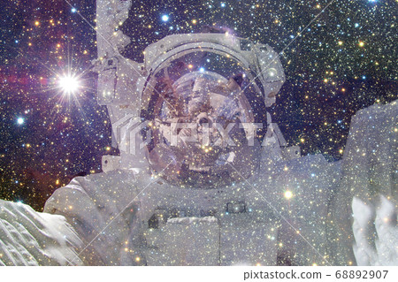 Astronaut. Nebula, cluster of stars. Elements of this image furnished by NASA Astronaut. Nebula, cluster of stars. Elements of this image furnished by NASA 68892907