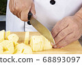 Chef cutting potato to make mashed Potatoes 68893097
